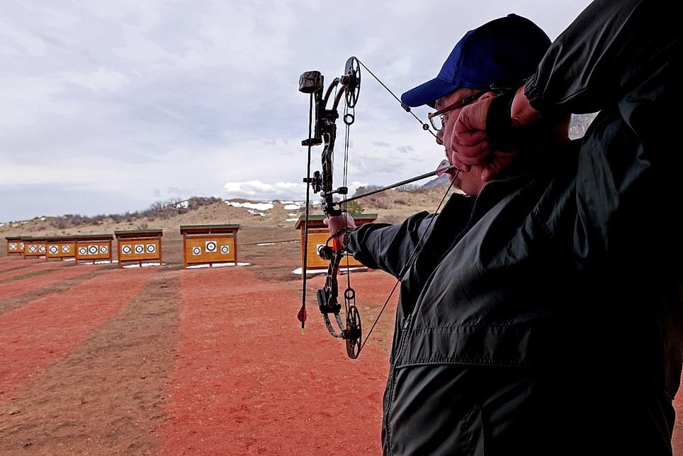 Man shoots with a bow